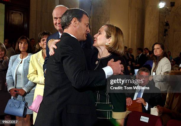 Judge John G. Roberts Jr., hugs his wife Jane Sullivan Roberts, after the first day of the Senate Judiciary Committee hearing on his nomination for...