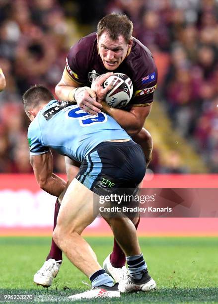 Tim Glasby of Queensland takes on the defence during game three of the State of Origin series between the Queensland Maroons and the New South Wales...