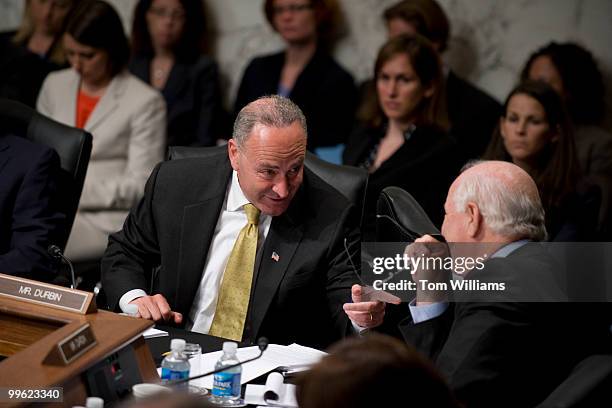 Sen. Charles Schumer, D-N.Y., left, talks with Sen. Ben Cardin, D-Md., during the Senate Judiciary Committee confirmation hearing on Supreme Court...