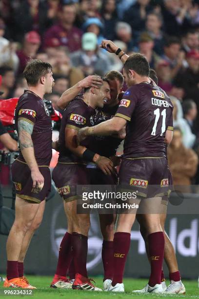 Billy Slater of the Maroons celebrates with team mates after winning game three of the State of Origin series between the Queensland Maroons and the...
