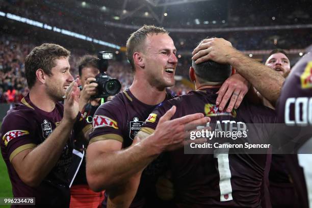 Daly Cherry-Evans of Queensland celebrates with team mates after winning game three of the State of Origin series between the Queensland Maroons and...