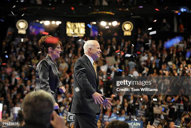 Sen. John McCain walks the stage with his running mate Gov. Sarah Palin after he accepted the Republican nomination for president on the last night...