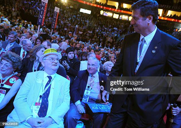 Former Sen. George Allen, right, talks with Virginia delegate Morton Blackwell on the second night of the Republican National Convention held at the...