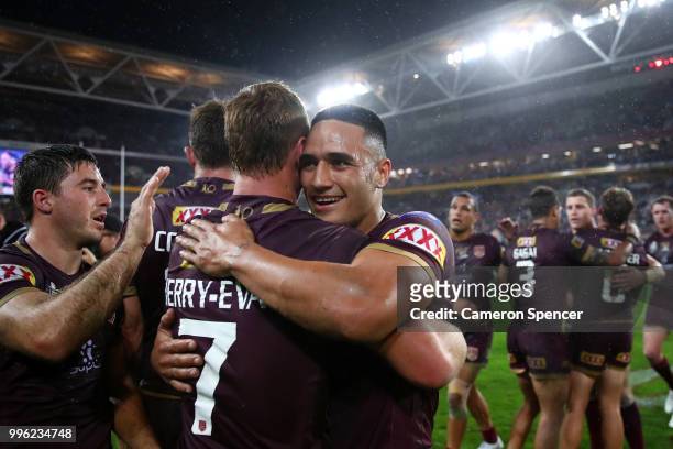 Valentine Holmes of Queensland celebrates with team mates after winning game three of the State of Origin series between the Queensland Maroons and...