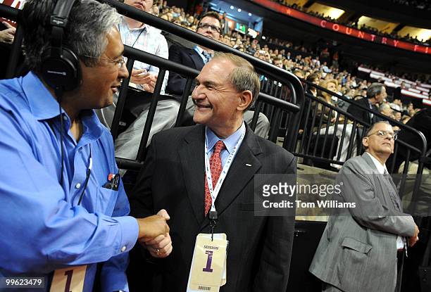 Former Governor Jim Gilmore, R-Va., right, talks to a reporter on second night of the Republican National Convention held at the Xcel Center in St....