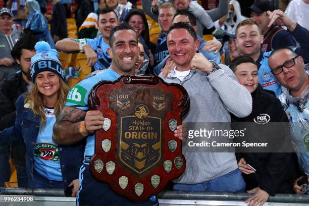 Paul Vaughan of the Blues poses with fans after winning the series following game three of the State of Origin series between the Queensland Maroons...