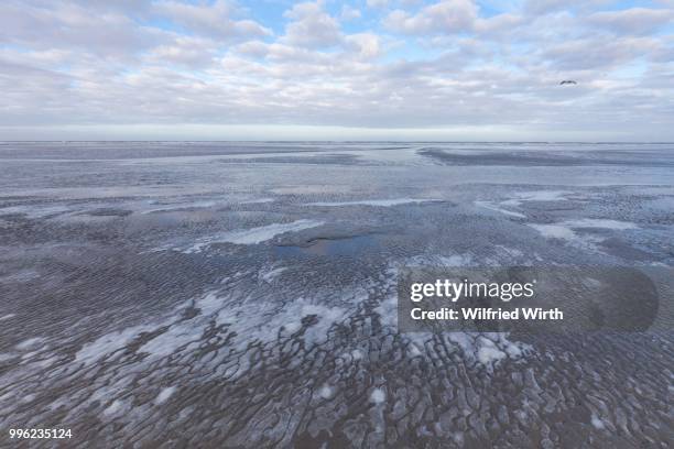 low tide in the lower saxon wadden sea national park, langeoog island, east frisia, north sea coast, lower saxony, germany - langeoog stock pictures, royalty-free photos & images