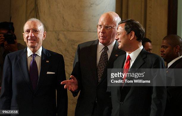 Chairman Arlen Specter, R-Pa., Sen. Patrick Leahy, D-Vt., and John Roberts speak before the Senate Judiciary Committee hearing on the nomination of...