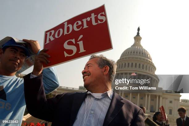 Oscar Jiron, right, and Rene Rivas, both of Nicaragua, attend a rally on the West Front, held by the National Coalition of Latino Clergy and...