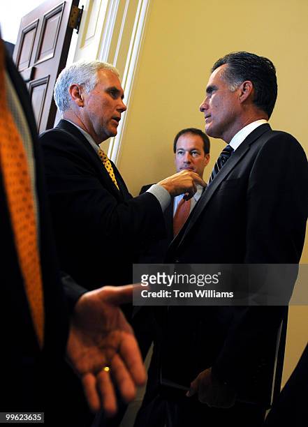 House Republican Conference Chairman Mike Pence, R-Ind., left, talks with former Gov. Mitt Romney after a hearing on the economy as it relates to...