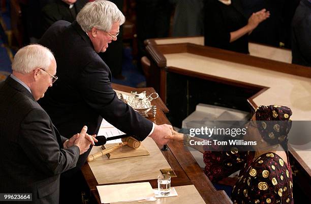 Ellen Johnson Sirleaf, president of the Republic of Liberia greets Speaker of the House Dennis Hastert, R-Ill., and Vice President Dick Cheney, far...