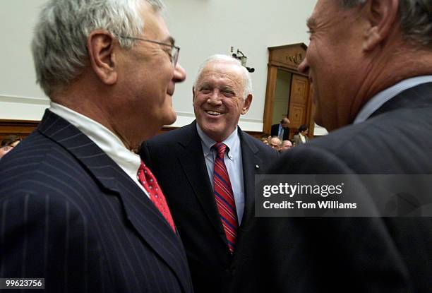 Former Senator Warren Rudman, center, talks with Reps. Barney Frank, D-Mass., left, and Mike Oxley, R-Ohio, before the start of a House Committee on...