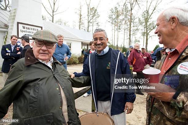 Rep. Bobby Scott, D-Va., center, greets Herbert Staples left, at the Wakefield Ruritan Club Shad Planking in Wakefield, Va., April 15, 2009.