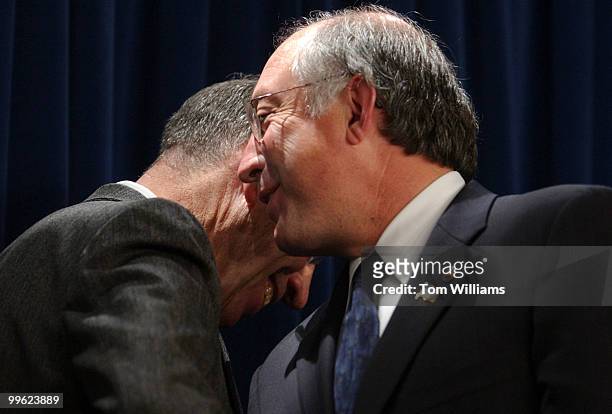 Sen. Ken Salazar, D-Colo., right, has a word with Sen. Chuck Grassley, R-Iowa, at a news conference introducing bipartisan legislation co-sponsered...