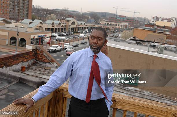 Anwar Saleem, executive director, H Street Main Street, poses for a photo on roof deck on H Street, NE.