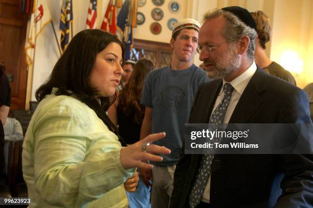 Sarri Singer, right, former constituent of Rep. Chris Smith, R-N.J., talks to Marc Belzberg of One Family, which gives support to victims and...