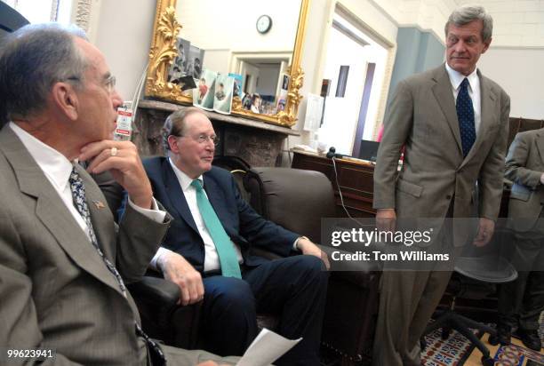 From left, Sens. Chuck Grassley, R-Iowa, John Rockefeller, D-W.V., and Max Baucus, D-Mont., prepare for a news conference supporting the...