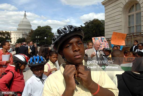 Antwan Brown from Bunker Hill Elementary in Northeast, puts on his helmet at a news conference to announce the release of a new report on the...