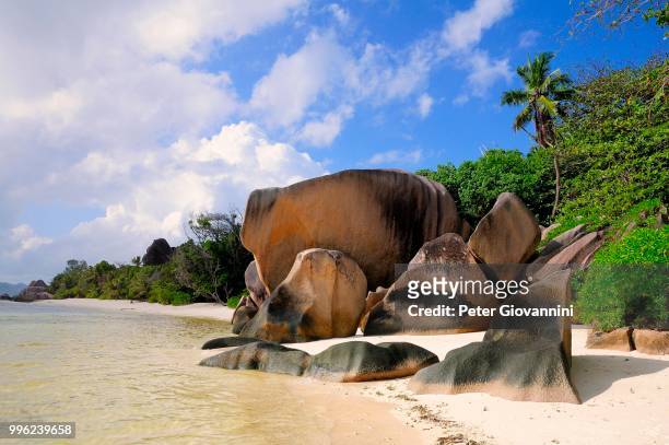 granite rocks on the beach, la digue island, la digue and inner islands, seychelles - peter island stock pictures, royalty-free photos & images