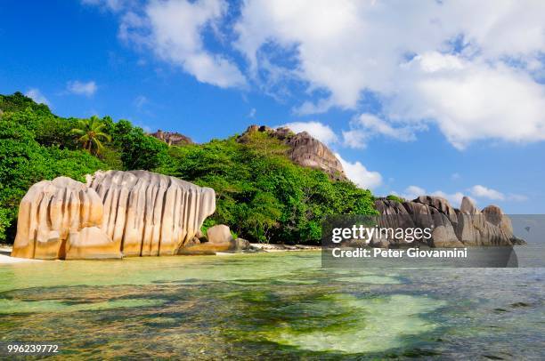 granite rocks on anse source d'argent beach, la digue island, la digue and inner islands, seychelles - peter island stock pictures, royalty-free photos & images