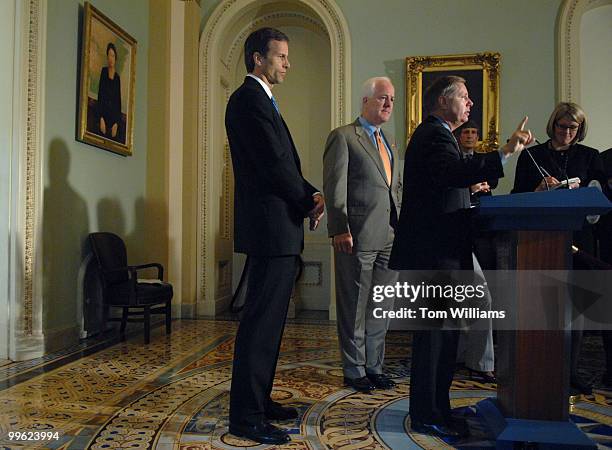 From left, Sens. John Thune, D-S.D., John Cornyn, R-Texas, and Lindsey Graham, R-S.C., address to reporters after President Bush's speech on Iraq.