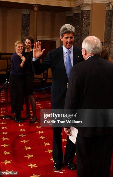 Sen. John Kerry, D-Mass., is sworn into the 108th Congress by Vice President Dick Cheney in the Old Senate Chamber, as Kerry's daughters Vanessa, in...