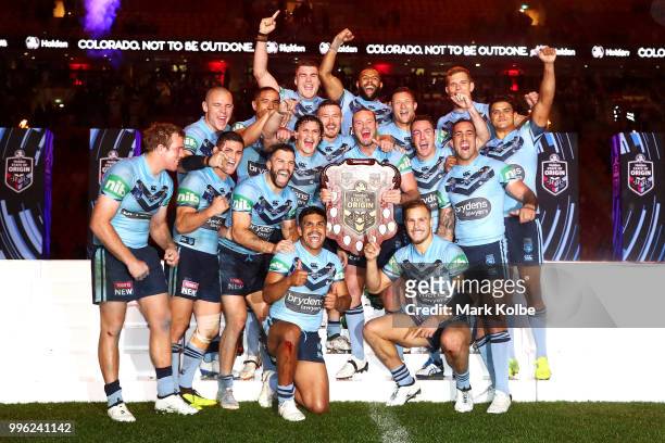The Blues celebrate with the shield after a series win after game three of the State of Origin series between the Queensland Maroons and the New...