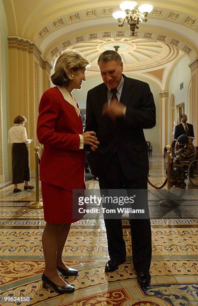 Sens. Kay Bailey Hutchison, R-Texas, and Jon Kyl, R-Ariz., talks in the Ohio Clock Corridor after Sen. Frist and numerous other Republicans, spoke to...