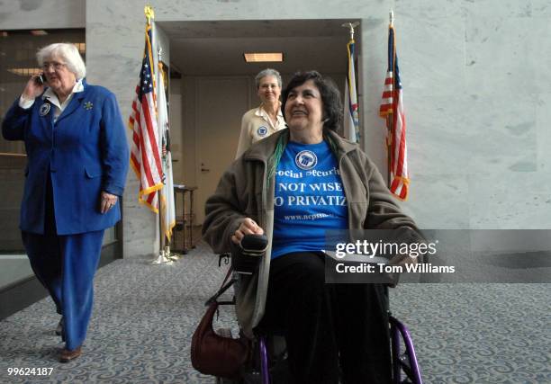 Mary Gross, right, is followed by fellow members of the National Committee to Preserve Social Security and Medicare, Sue Ward, left, and Anna...