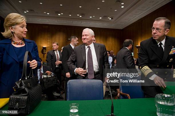 Secretary of State Hillary Clinton, Secretary of Defense Robert Gates and Chairman of the Joint Chiefs of Staff Adm. Mike Mullen prepare to leave a...