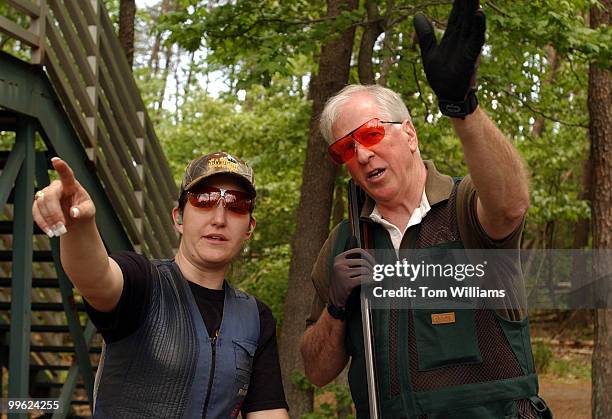 Rep. Mike Thompson, D-Calif., talks strategy with 2-time Olympic Gold Medalist with the USA Shooting Team, Kim Rhode, of L.A., during the 2005...