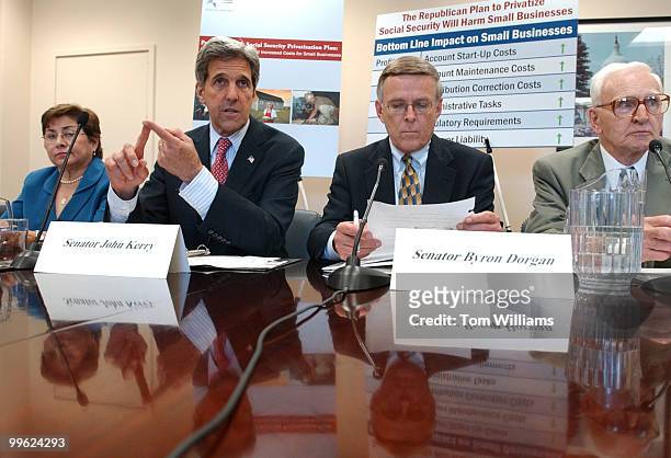 Sens. John Kerry, D-Mass., and Byron Dorgan, D-N.D., attend a news conference to unveil a Senate Democratic Policy Committee report on the impact of...