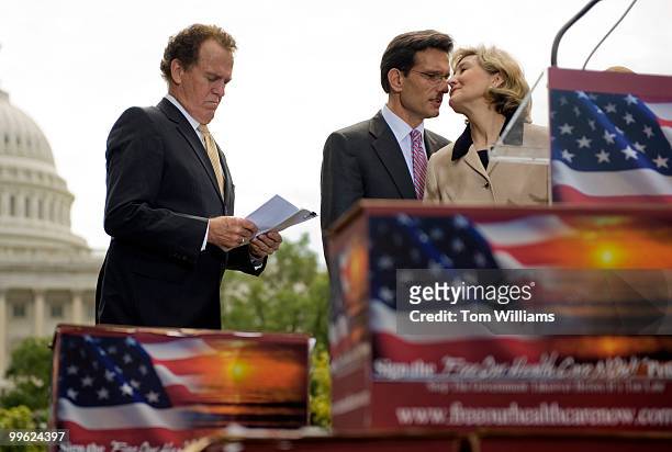 Sem. Kay Bailey Hutchison, R-Texas, has a word with House Minority Whip Eric Cantor, R-Va., before a rally where boxes of 1.3 million signatures were...