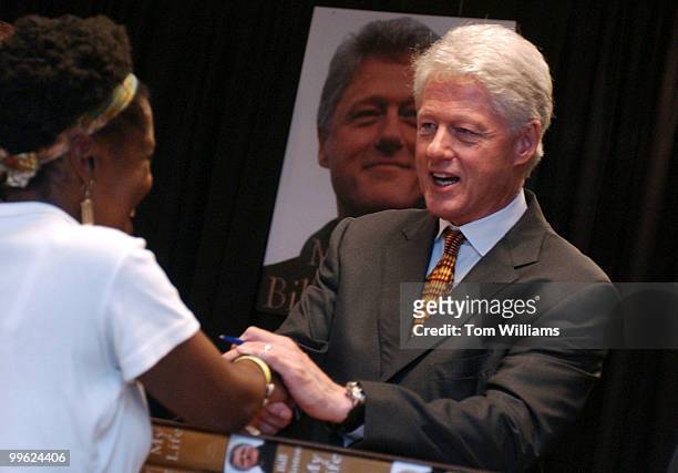 Fan meets Bill Clinton, at the Barnes and Noble on 12th and E, NW, during a book signing by the former president.