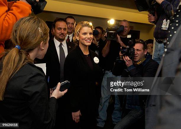 Actress and Operation Smile International Youth Ambassador Jessica Simpson arrives at a news conference to discuss the charity which is a private,...