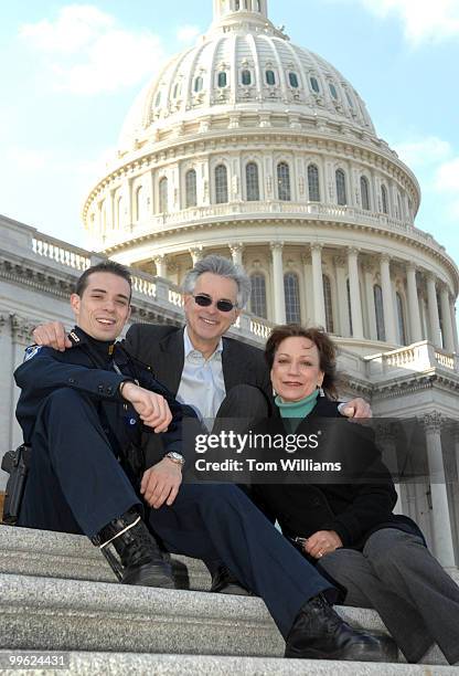 Capitol Police Officer Aidan Sims is pictured with his father David Sims, a House photographer, and mother Gretel Lauro a staffer for Rep. George...