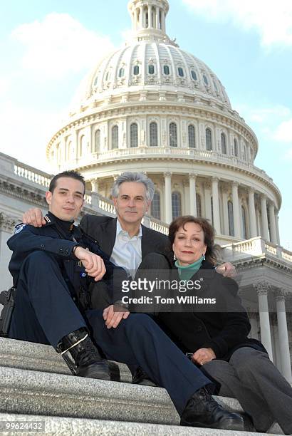 Capitol Police Officer Aidan Sims is pictured with his father David Sims, a House photographer, and mother Gretel Lauro a staffer for Rep. George...