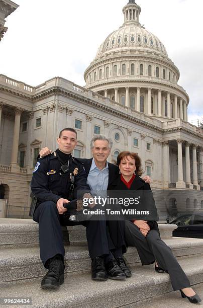 Capitol Police Officer Aidan Sims is pictured with his parents David Sims, a House photographer, and his mother Gretel Sims, a staffer for Rep....