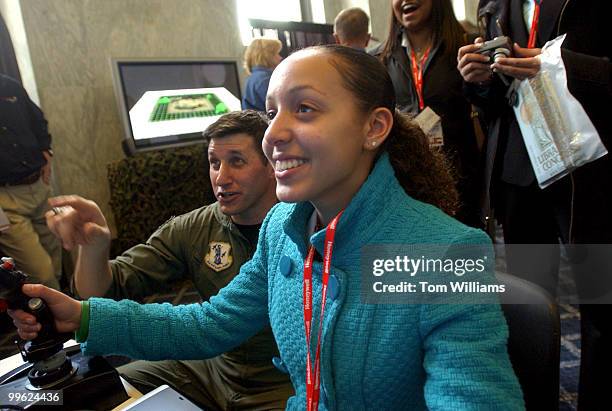 Major Andy Davidson Taylor of the U.S. Air National Guard instructs Presidential Classroom student Sheanna Santos of R.I., on a F-16 flight...