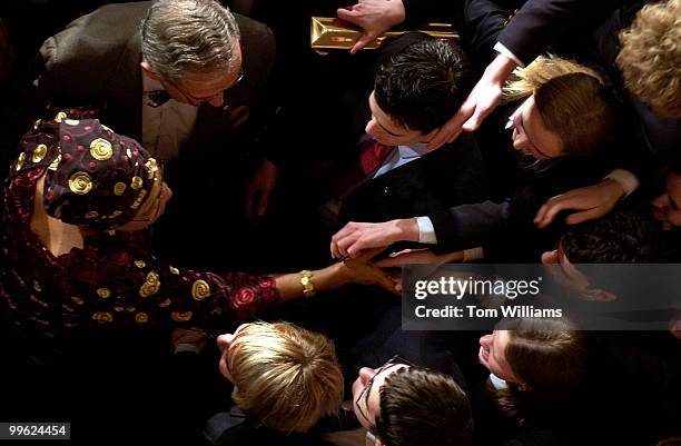 Ellen Johnson Sirleaf, president of the Republic of Liberia, greets pages in the House Chamber after she addressed a joint session of Congress.