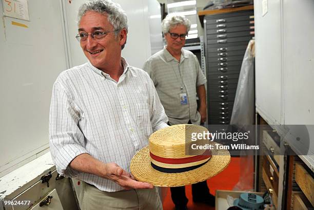 Harry Rubenstein, chair, Division of Politics and Reform, Smithsonian National Museum of American History, shows off an Eisenhower delegate hat which...