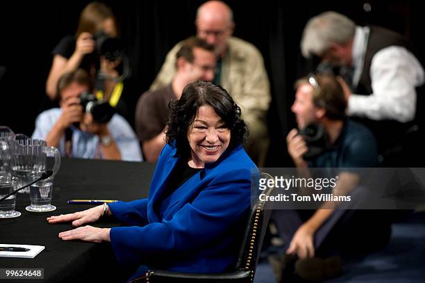Supreme Court nominee Sonia Sotomayor talks to a members of her entourage during a break in her Senate Judiciary Committee confirmation hearing in...
