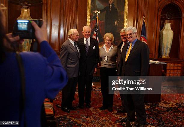 Beverly Braun, of the House Radio TV Gallery, gets her picture taken with from left former House Speakers, Jim Wright, Tom Foley, current Speaker...