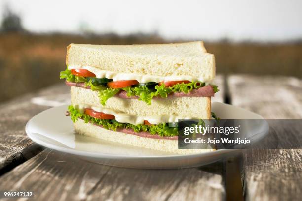 sandwich on wooden table - マヨネーズ ストックフォトと画像