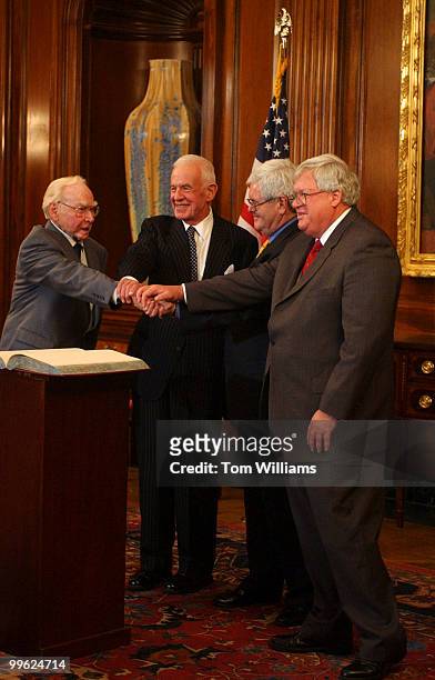Former House Speakers, Jim Wright, Tom Foley, Newt Gingrich, and current Speaker Dennis Hastert join hands after participating in "The Changing...