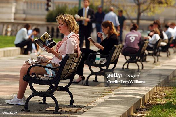 Sherry Little of the Senate Banking Committee, has lunch outside with many other hill staffers, in Upper Senate Park, Monday.