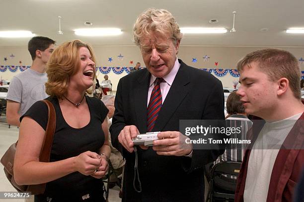 Potential Senate candidate Jerry Springer, D-Ohio, has a laugh with Jessica Allen as she shows him a digital photo at the Ross County Democratic...