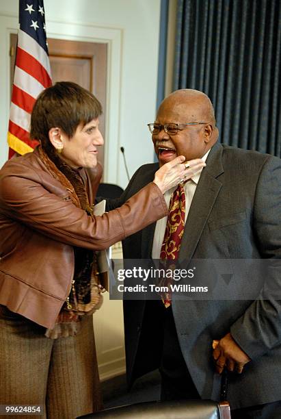 Reg Weaver president of the National Education Association greets Rep. Rosa DeLauro, D-Conn., before a news conference to urge Congress to act...