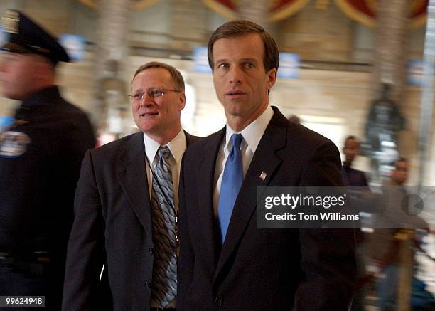 Sen. John Thune, R-S.D., makes his way through Statuary Hall before the State of the Union Address.