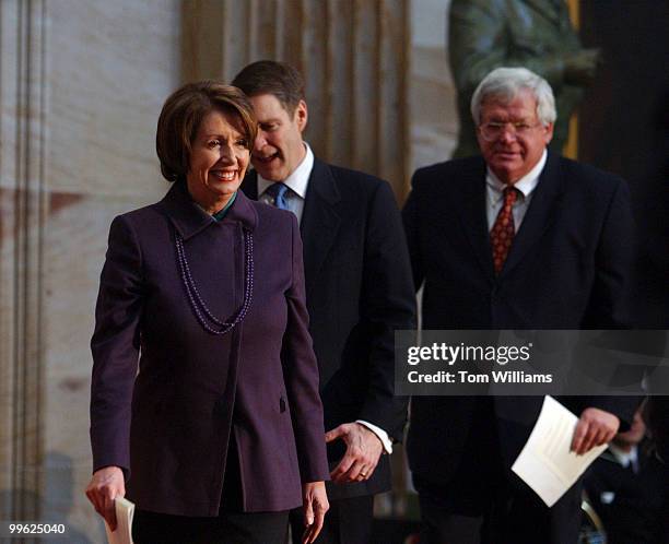 House Minority Leader Nancy Pelosi, D-Calif., followed by Sen. Majority Leader Bill Frist, R-Tenn., and Speaker Dennis Hastert, R-Ill., arrive at the...